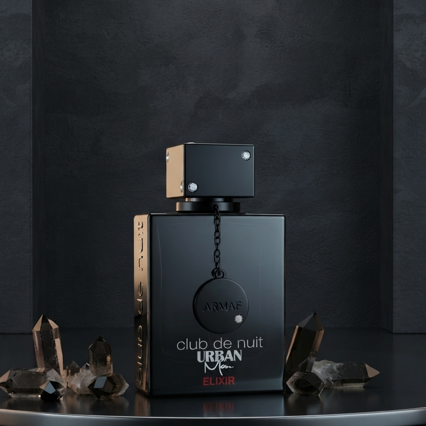 A black rectangular perfume bottle labeled 'club de nuit URBAN EL MR' with a metallic cap, displayed on a dark reflective surface with crystal clusters against a dark textured background.