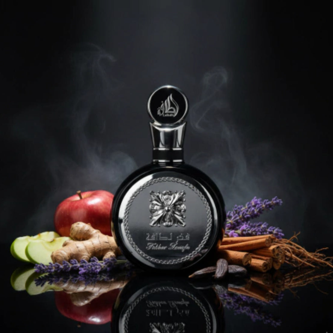 Perfume bottle with ingredients like apples, lavender, and cinnamon on a dark background SHE GLOW ✨