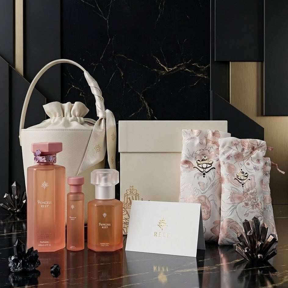 Cosmetic products and packaging on a dark marble surface with a black and gold abstract wall.