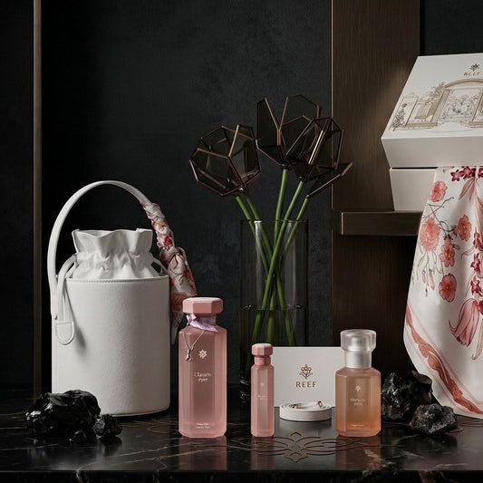 Cosmetic products and accessories on a dark surface with a decorative box in the background.