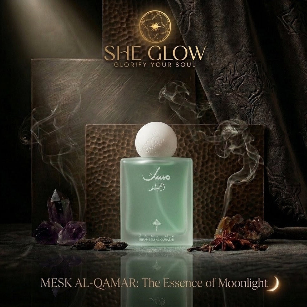She Glow perfume bottle with packaging and decorative elements on a dark background