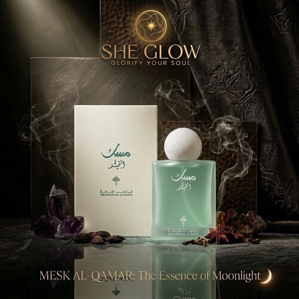 She Glow perfume with packaging and decorative elements on a dark background