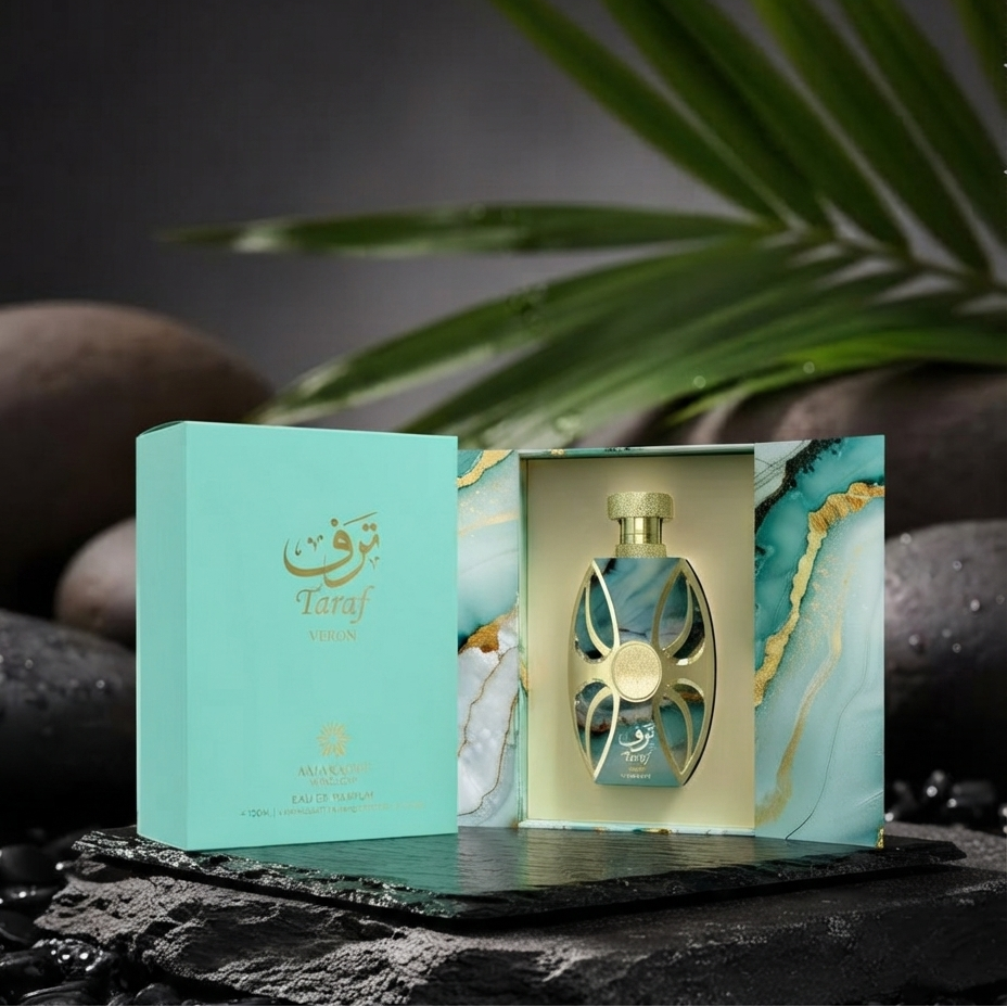 A perfume bottle with a gold cap displayed inside an open matching box next to its closed turquoise outer box. The packaging features a turquoise and gold marbled design with Arabic calligraphy. SHE GLOW 