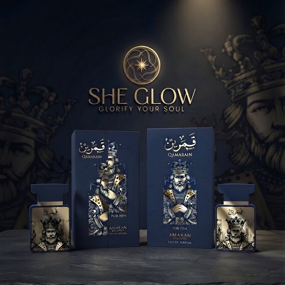 She Glow Qumainan perfume set featuring two tall blue boxes with gold and silver illustrated figures, flanked by two matching blue bottles with gold-toned labels, set against a dark background with a crown and face illustration.