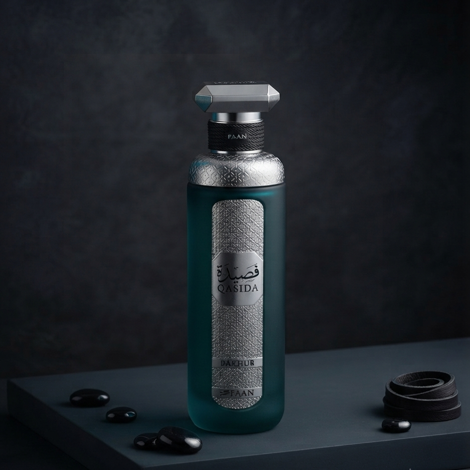A frosted glass bottle of Casida Rasasiyyah Daraja perfume oil, featuring a dark teal body, a textured silver label, and a silver cap, displayed on a dark gray pedestal with decorative stones.
SHE GLOW ✨