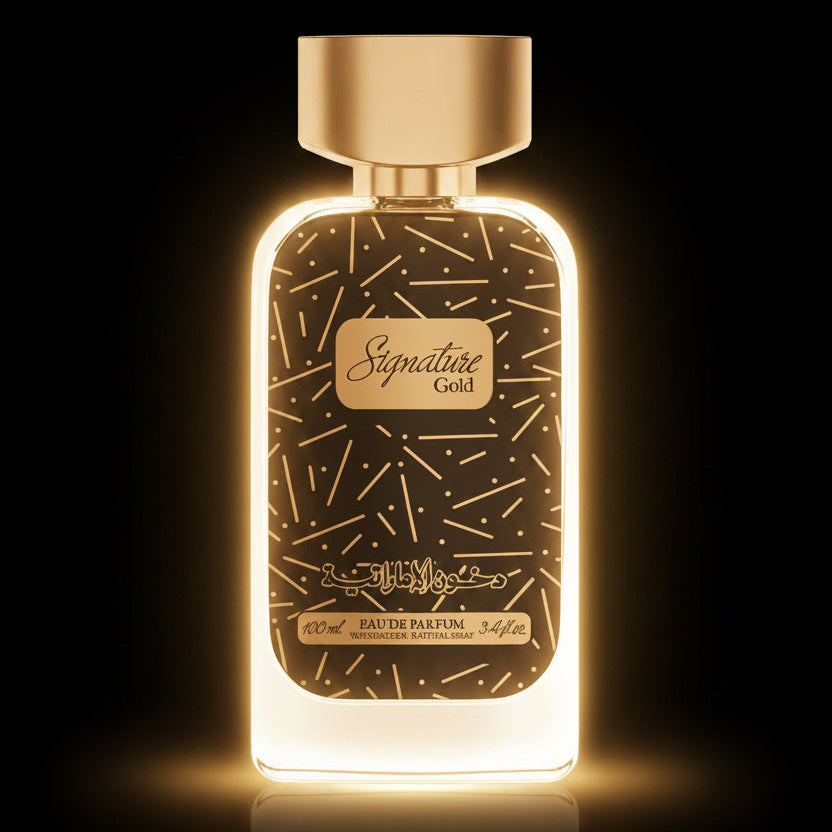 A 100ml bottle of Signature Gold Eau de Parfum with a black and gold speckled label and a metallic gold cap, shown on a checkered background.SHE GLOW 