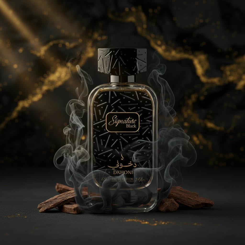 A bottle of DKHONI Signature Black Eau de Parfum next to its black packaging box with gold lettering, set against a plain light gray background.            SHE GLOW 