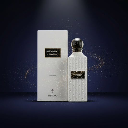 White Regent Diamond Eau de Parfum bottle and its matching white packaging box by the brand IBRAQ, featuring a textured diamond pattern on the bottle and a black spherical cap. SHE GLOW ✨