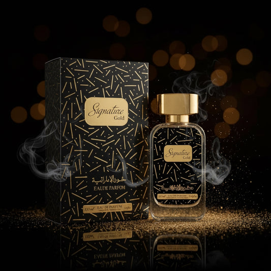 Signature Gold Eau De Parfum bottle and its matching black and gold patterned box, displayed side-by-side on a white background. SHE GLOW 
