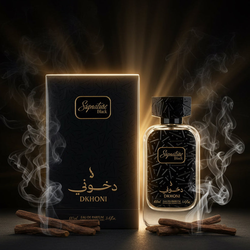 A bottle of DKHONI Signature Black Eau de Parfum next to its black packaging box with gold lettering, set against a plain light gray background.            SHE GLOW 