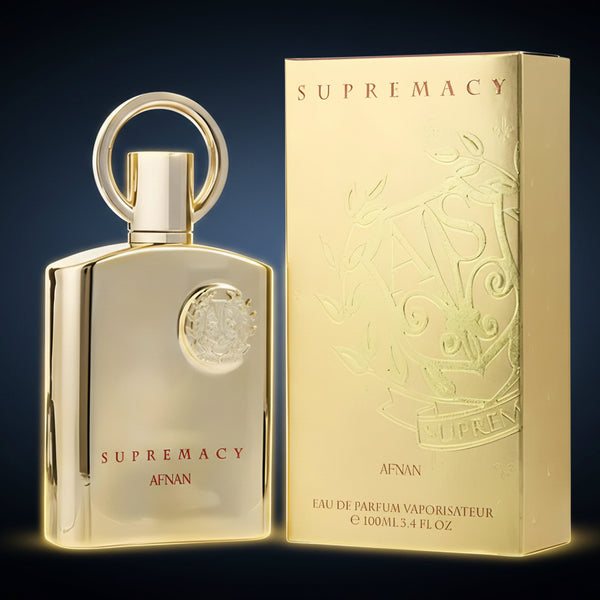 Gold perfume bottle and packaging with 'Supremacy' branding on a dark background SHE GLOW 