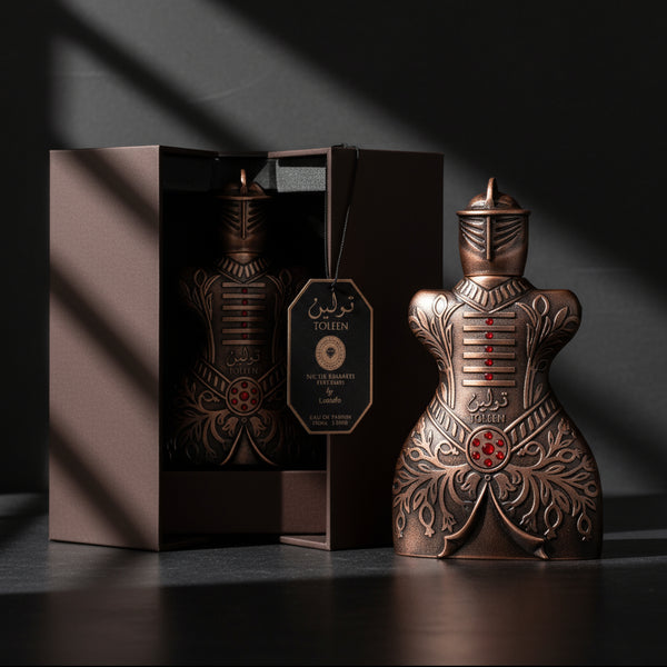 Decorative bottle with intricate designs and a matching box on a dark background SHE GLOW ✨