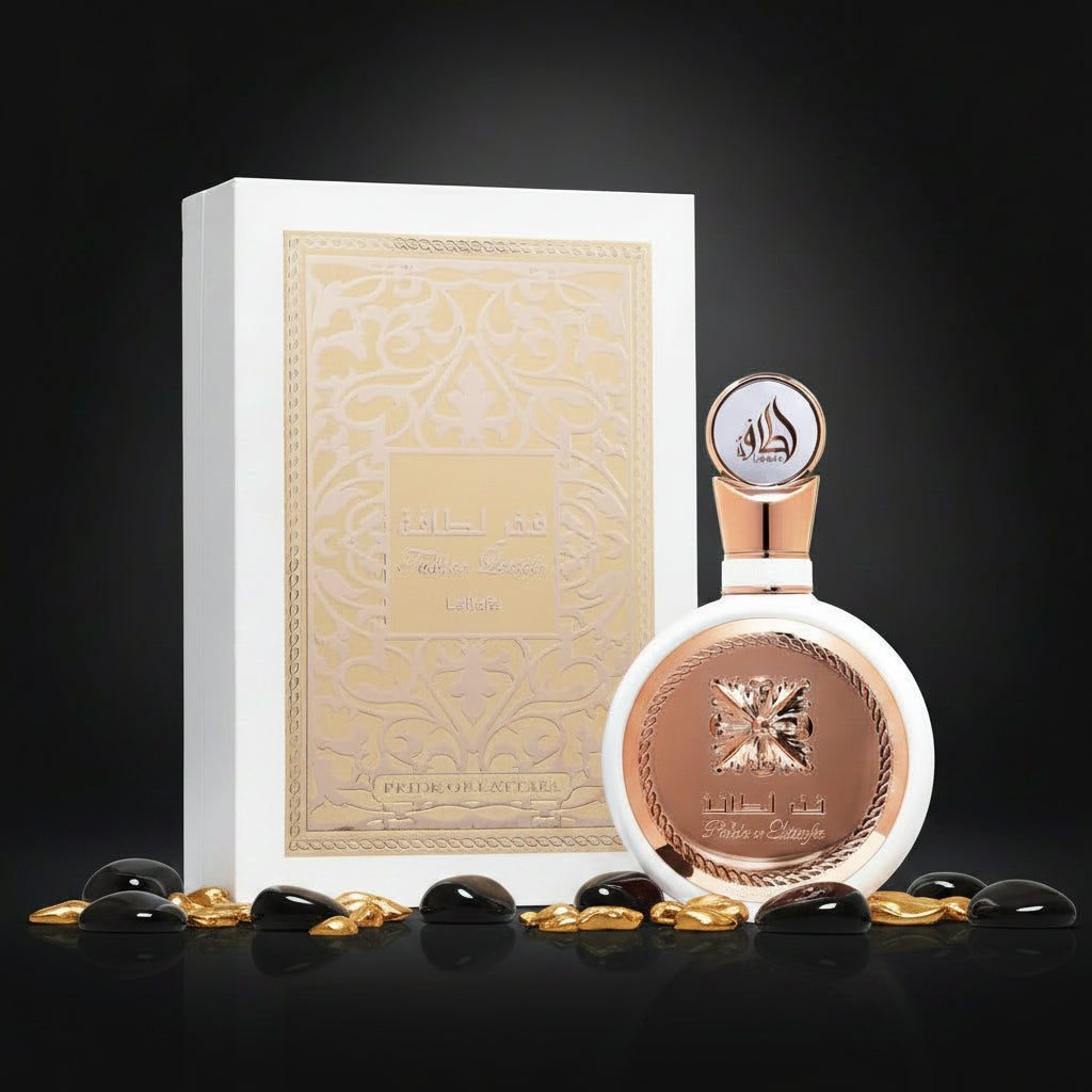 A perfume bottle with a rose gold cap and a round rose gold medallion, shown next to its white and gold presentation box. The bottle features Arabic text reading 'مطر لطافة' and 'Prince George', with 'Prince George' also visible on the box.
 SHE GLOW ✨
